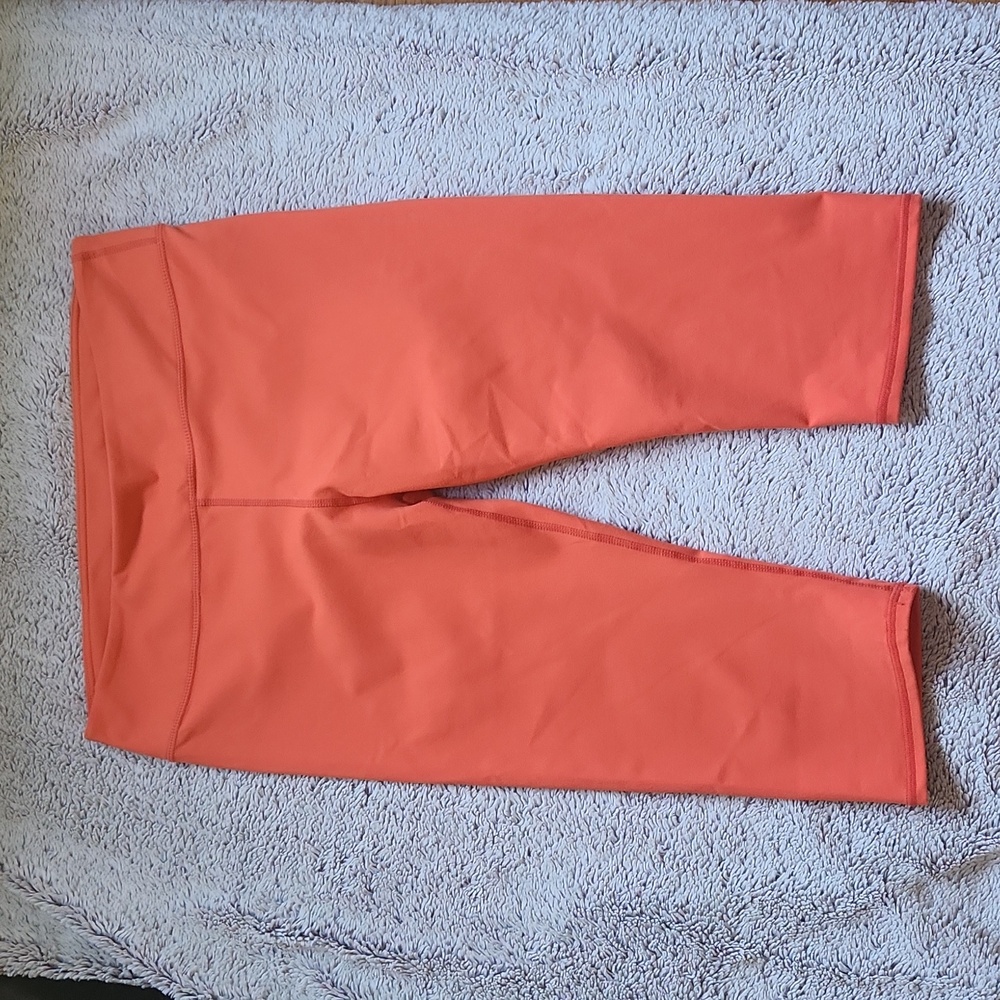 EUC Fabletics orange cropped leggings size lare